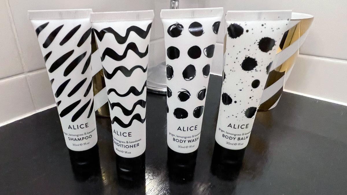 a group of white and black bottles with black and white designs