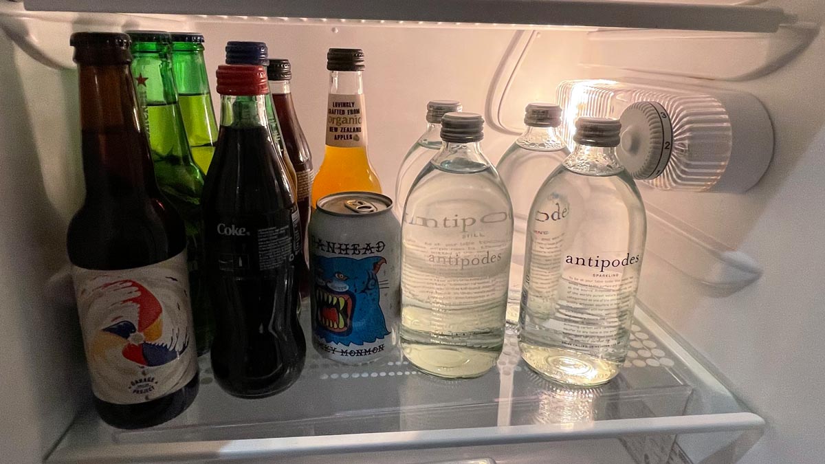 a group of bottles in a refrigerator