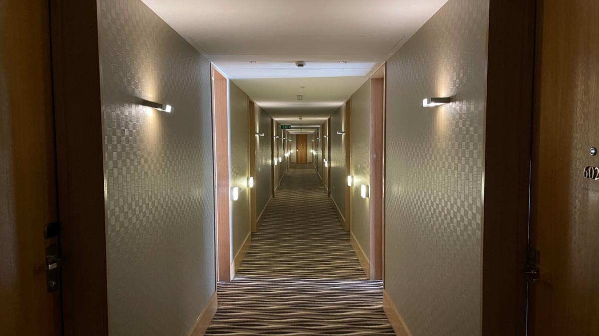 a hallway with lights on the wall