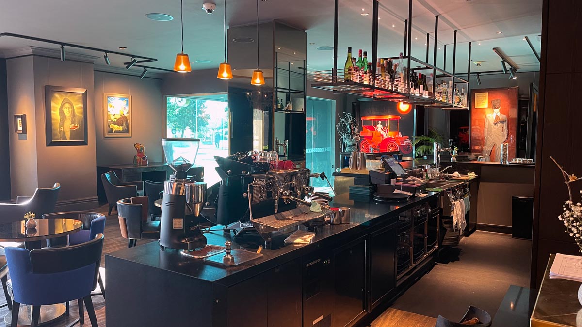 a bar with a counter and a few coffee machines