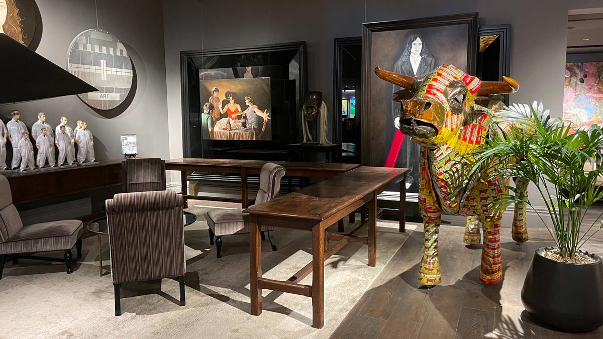 a room with a table and a statue of a bull