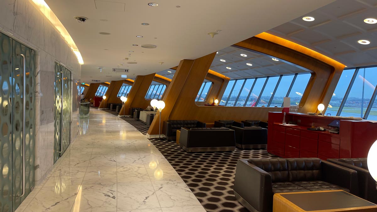 a large room with windows and a bar
