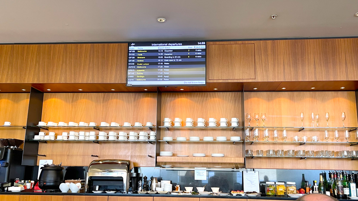 a display of coffee cups and glasses on shelves