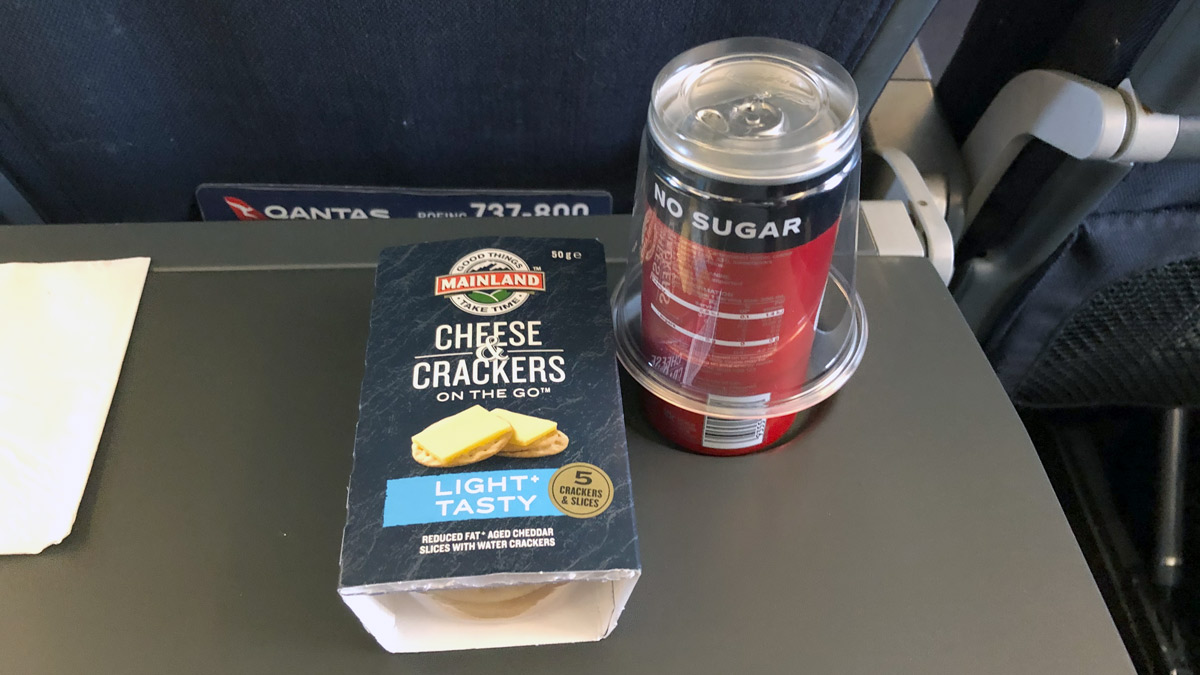 a can and a box of crackers on a table