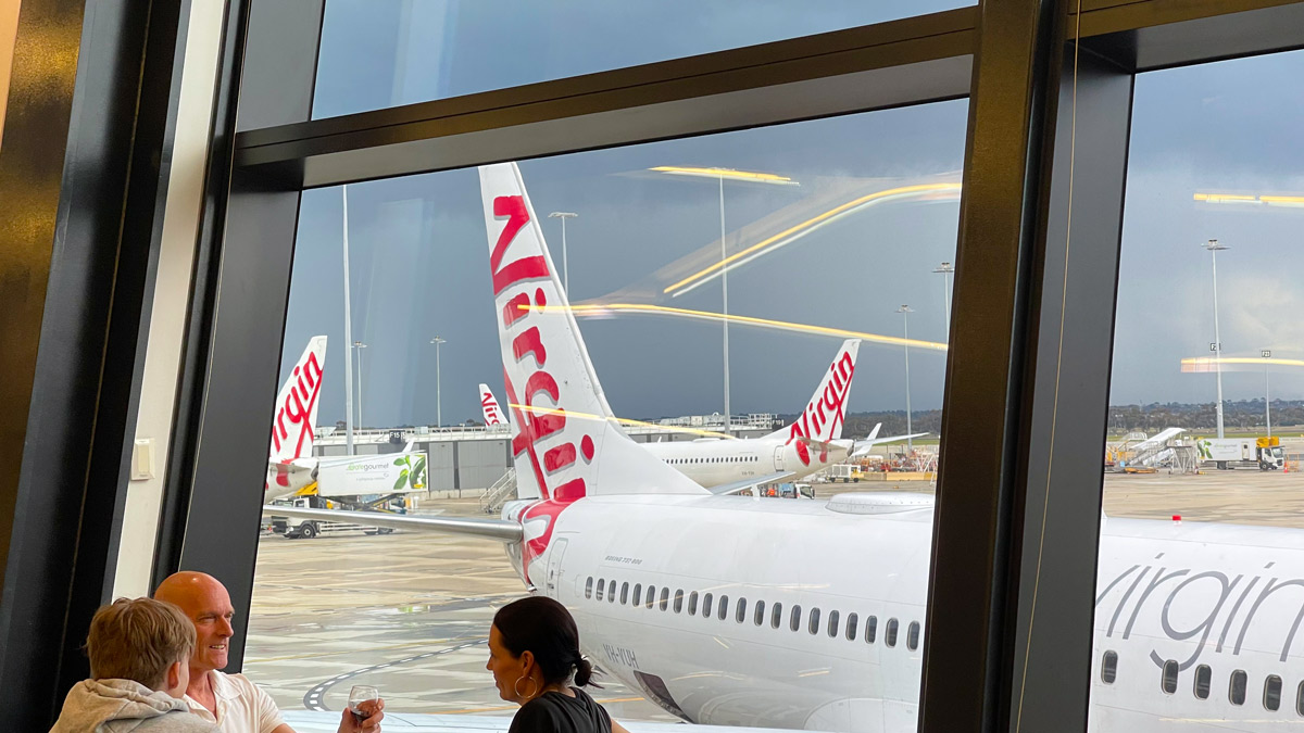 a group of airplanes in an airport