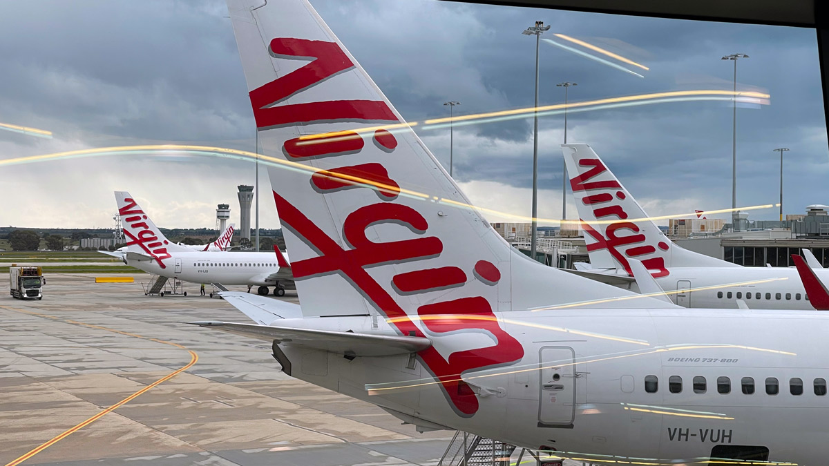 a group of airplanes at an airport