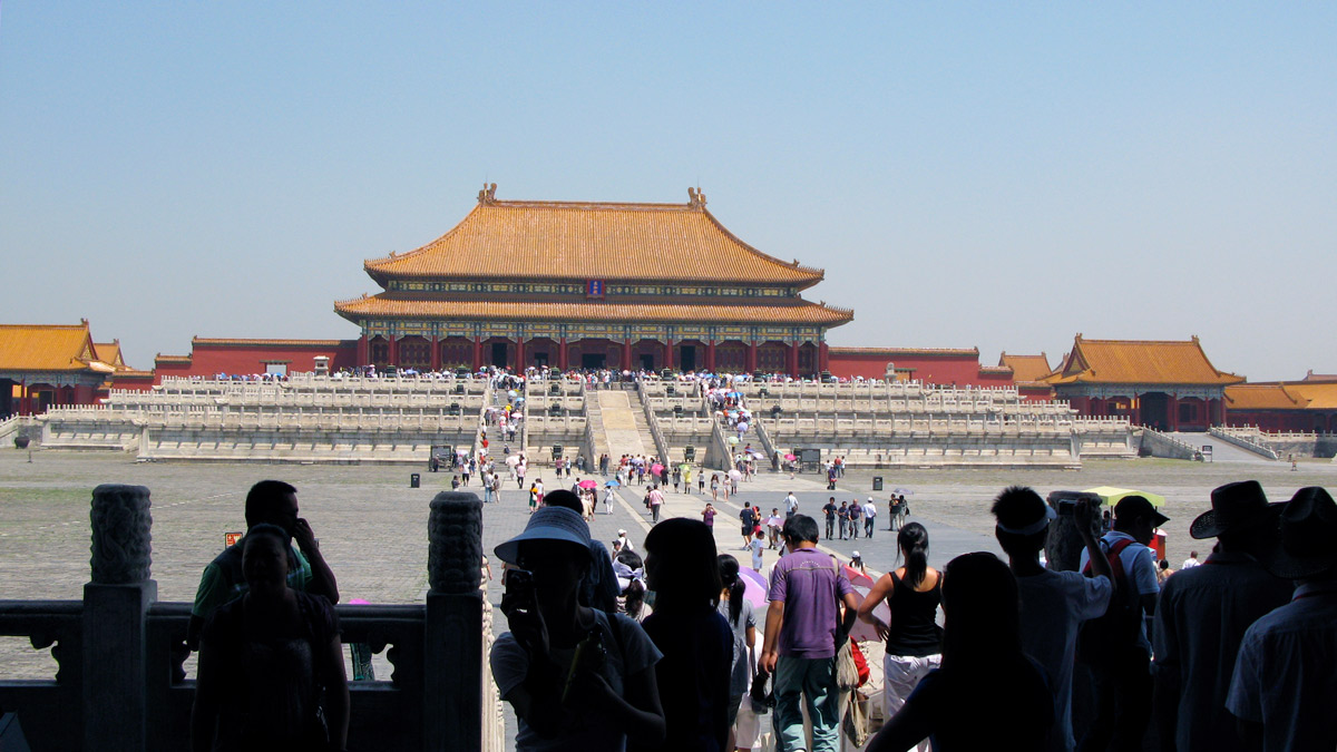 a group of people standing in front of Forbidden City