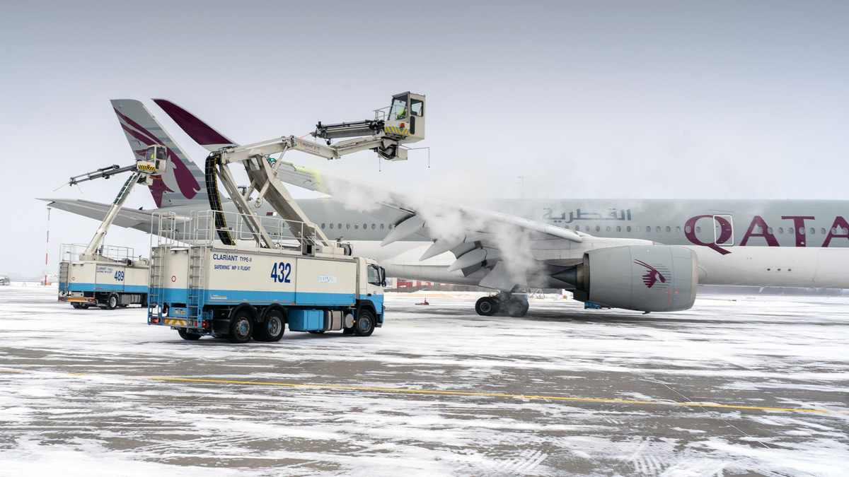 a truck and plane on the ground