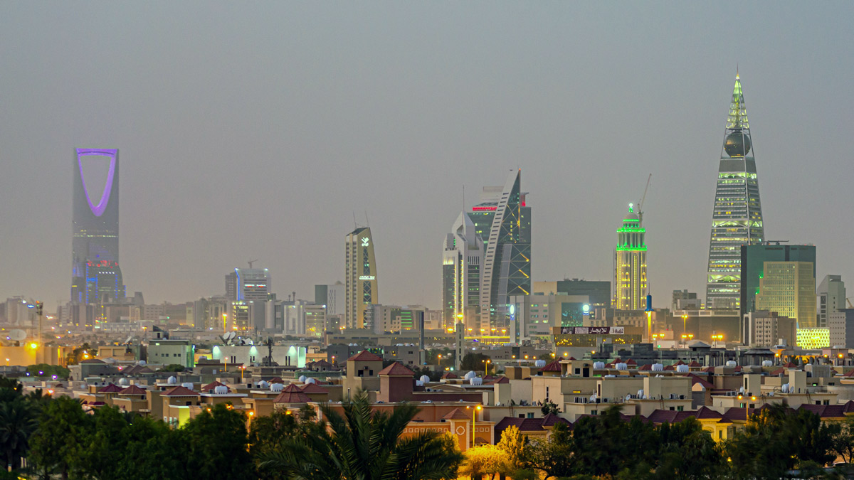 a city skyline with many tall buildings