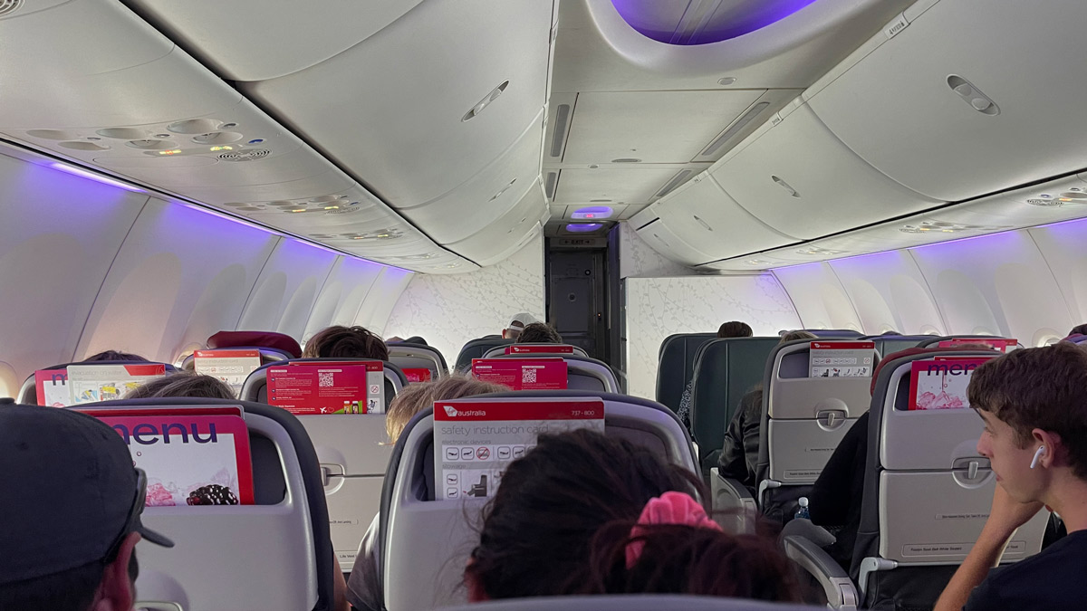 a group of people sitting in an airplane