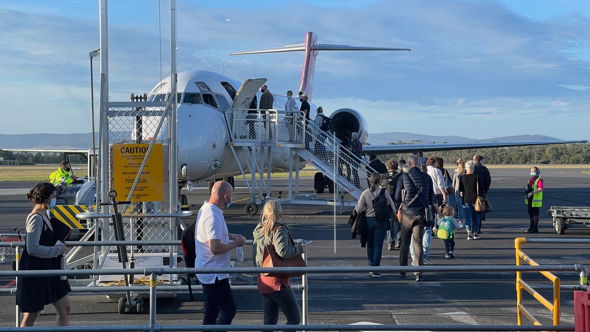 a group of people walking on a runway