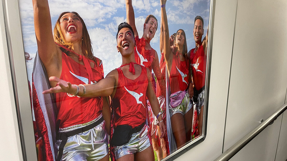 a group of people in red shirts