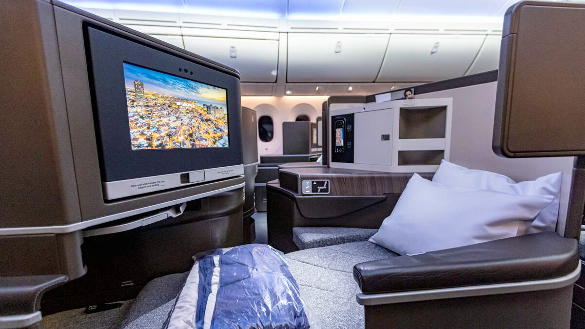 a tv and a couch in an airplane