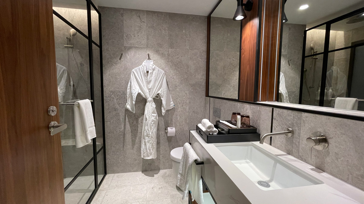 a bathroom with a bathrobe and sink