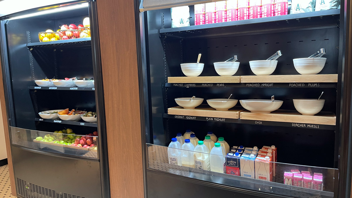 a shelf with bowls and milk on it