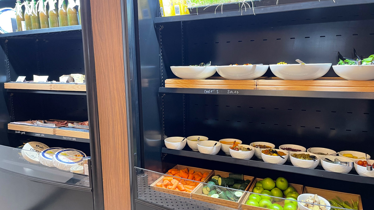 a shelf with bowls of food on it