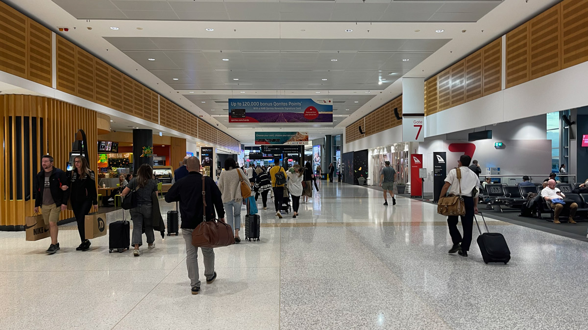 people walking in a large airport