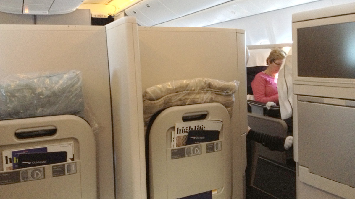 a woman sitting in a chair in an airplane