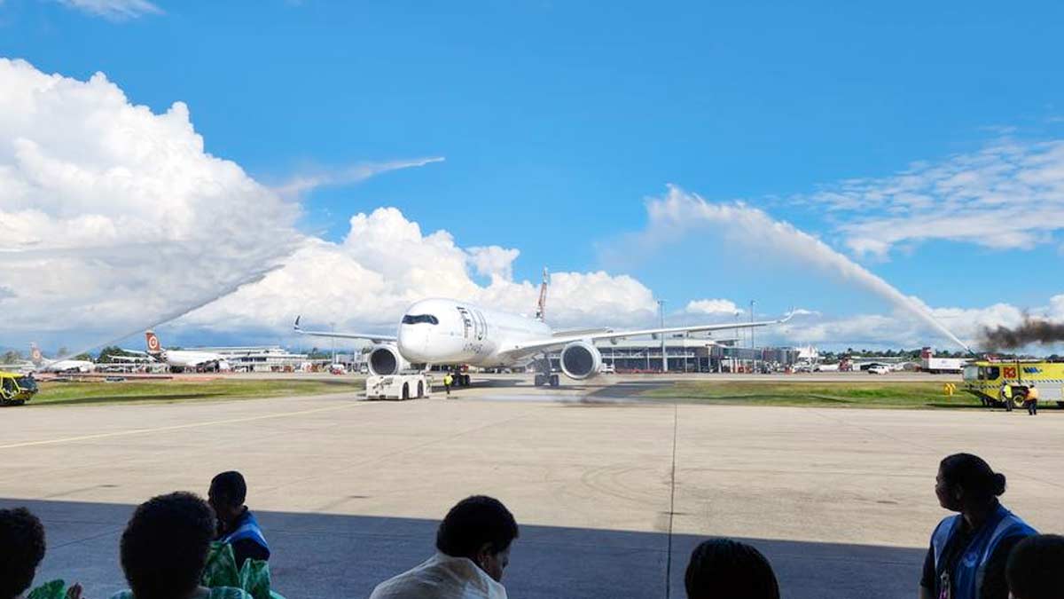 a large white airplane on a runway