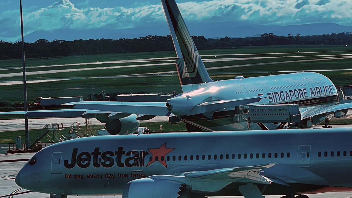 a group of airplanes on a runway