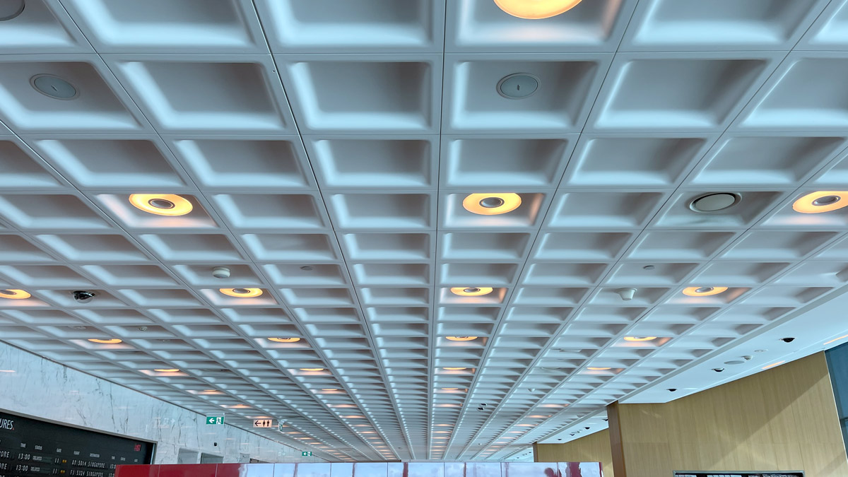 a ceiling with lights and a sign