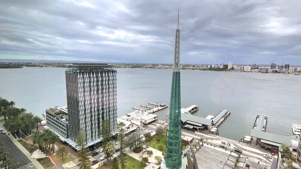 a tall building next to a body of water