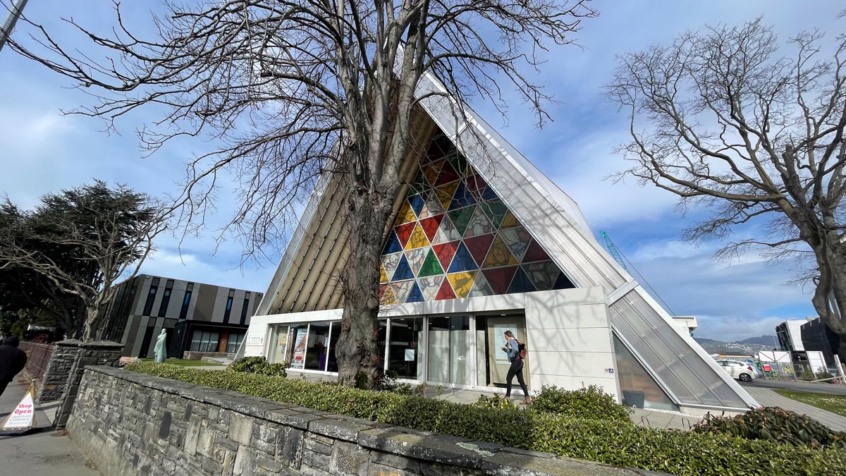 a building with a triangular shaped roof