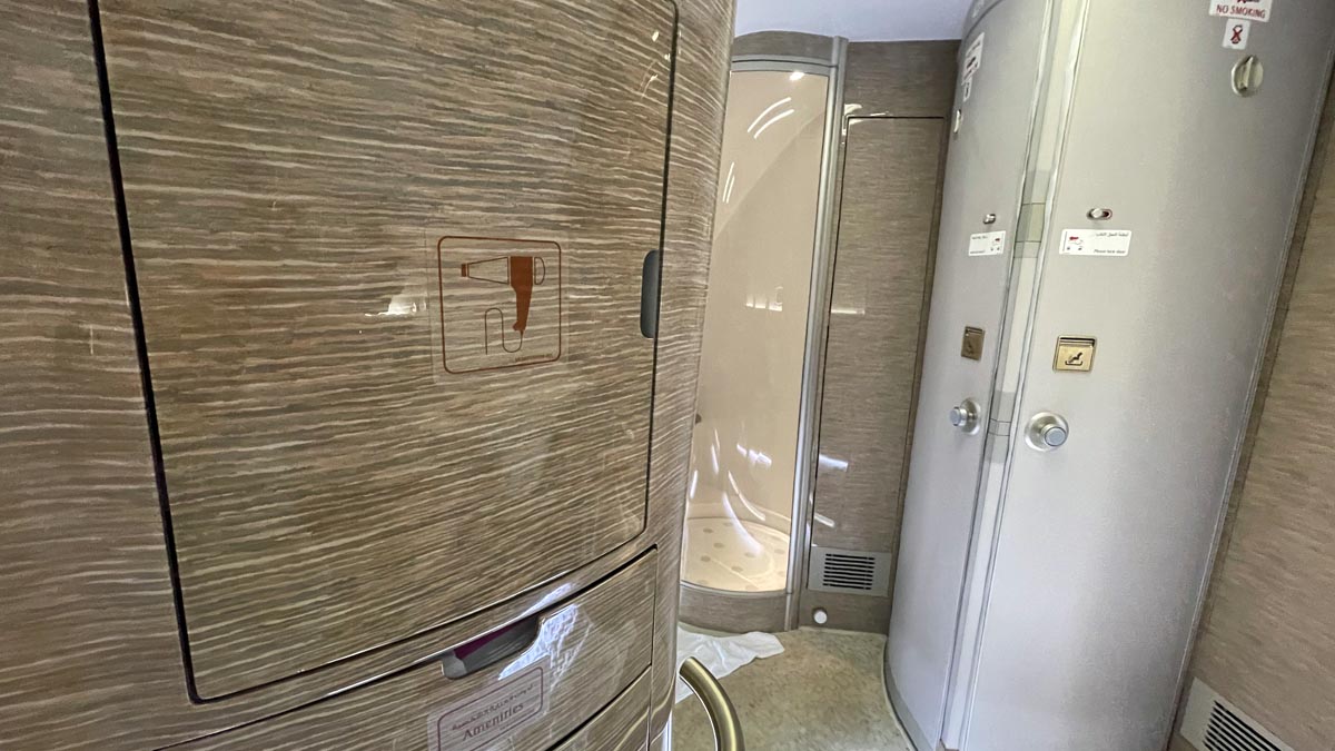 a bathroom with a shower and a door