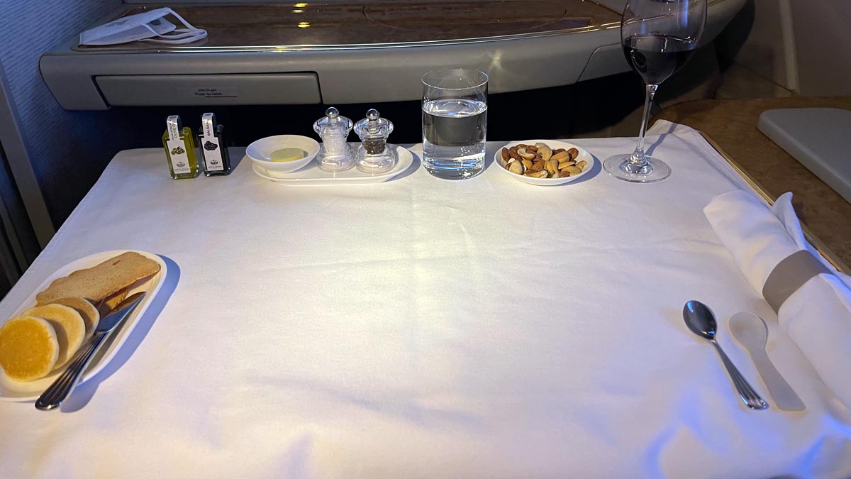 a table with food and a glass of wine on it