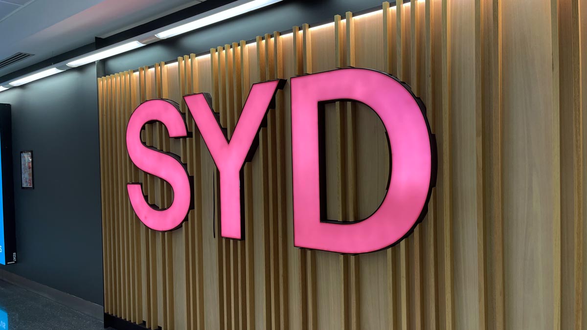 a pink sign on a wall