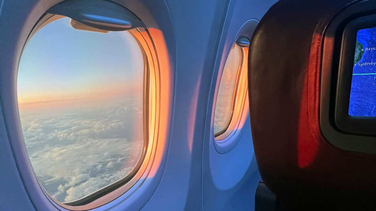 a plane with windows and clouds