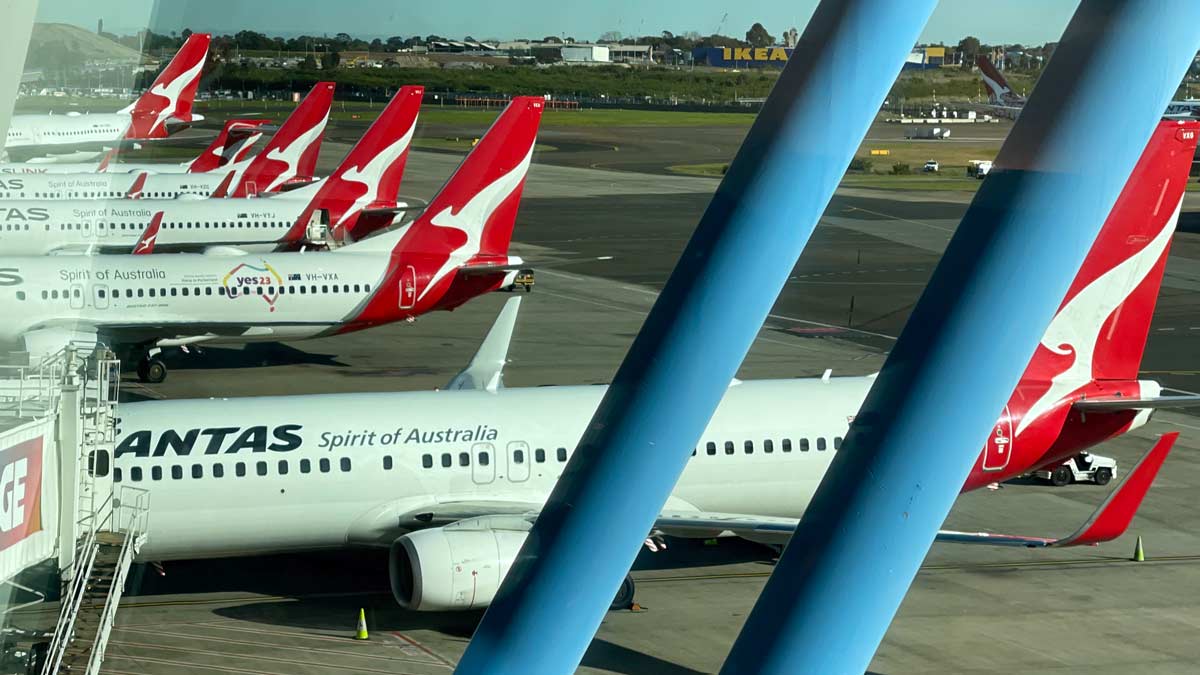 a group of airplanes on a runway