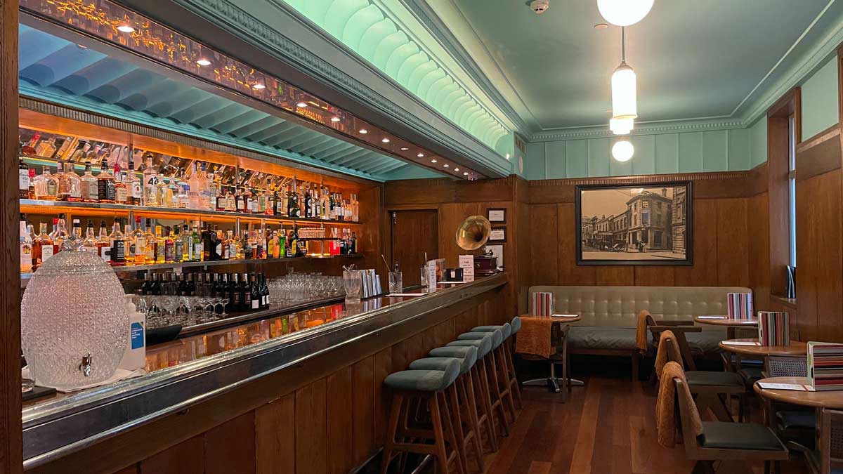 a bar with bottles of alcohol on shelves