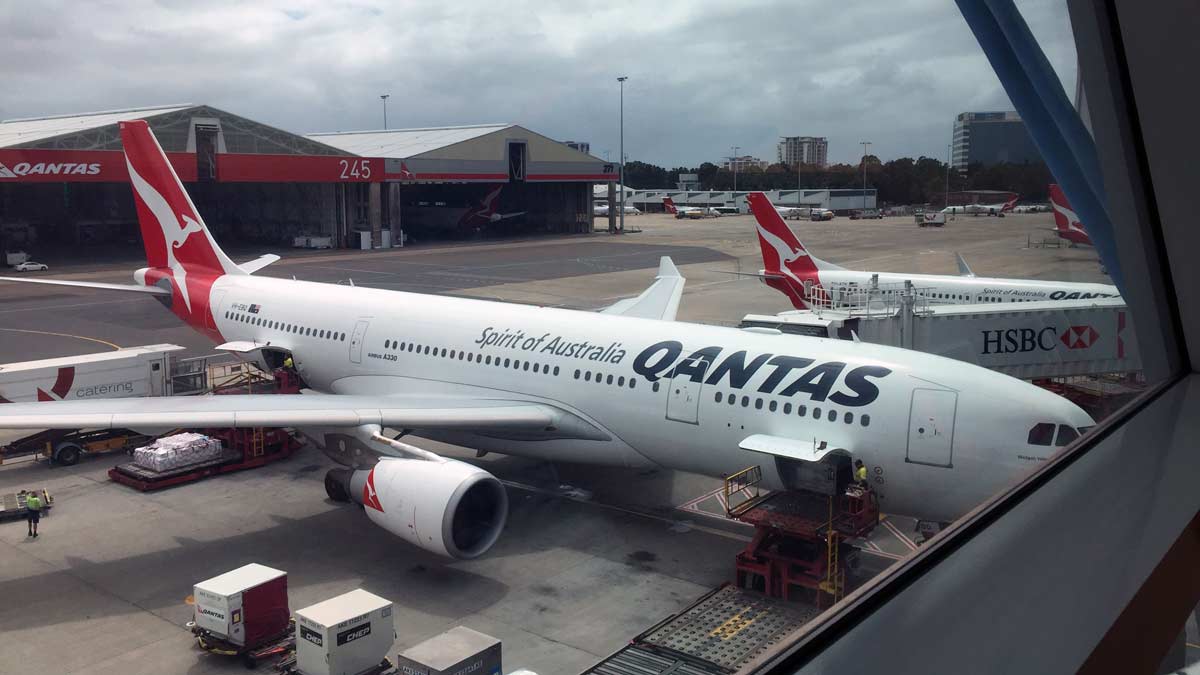 a large white airplane at an airport