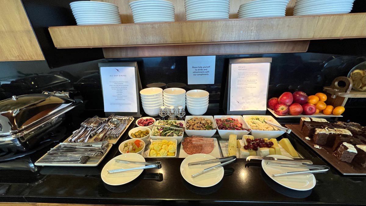 a buffet table with plates and food