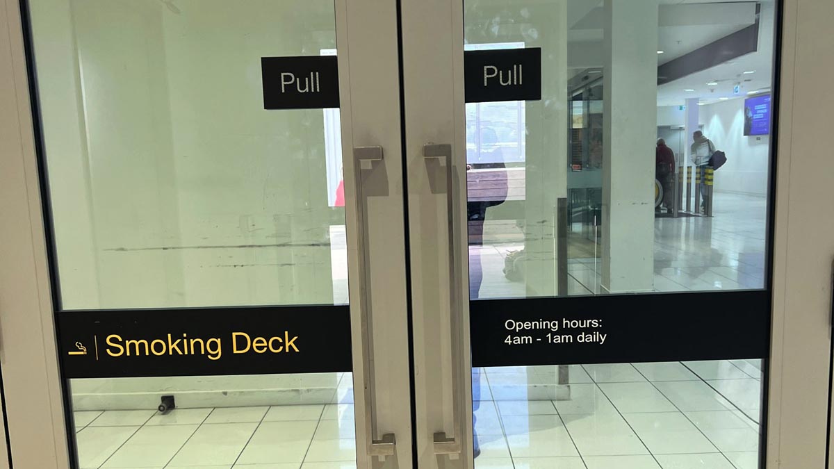 a glass door with signs on it