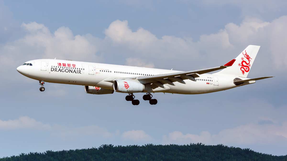 a white airplane flying in the sky