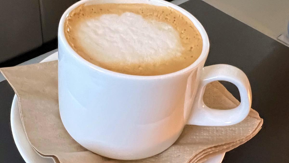 a cup of coffee with foam in it