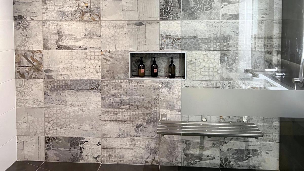 bottles in a shelf in a bathroom