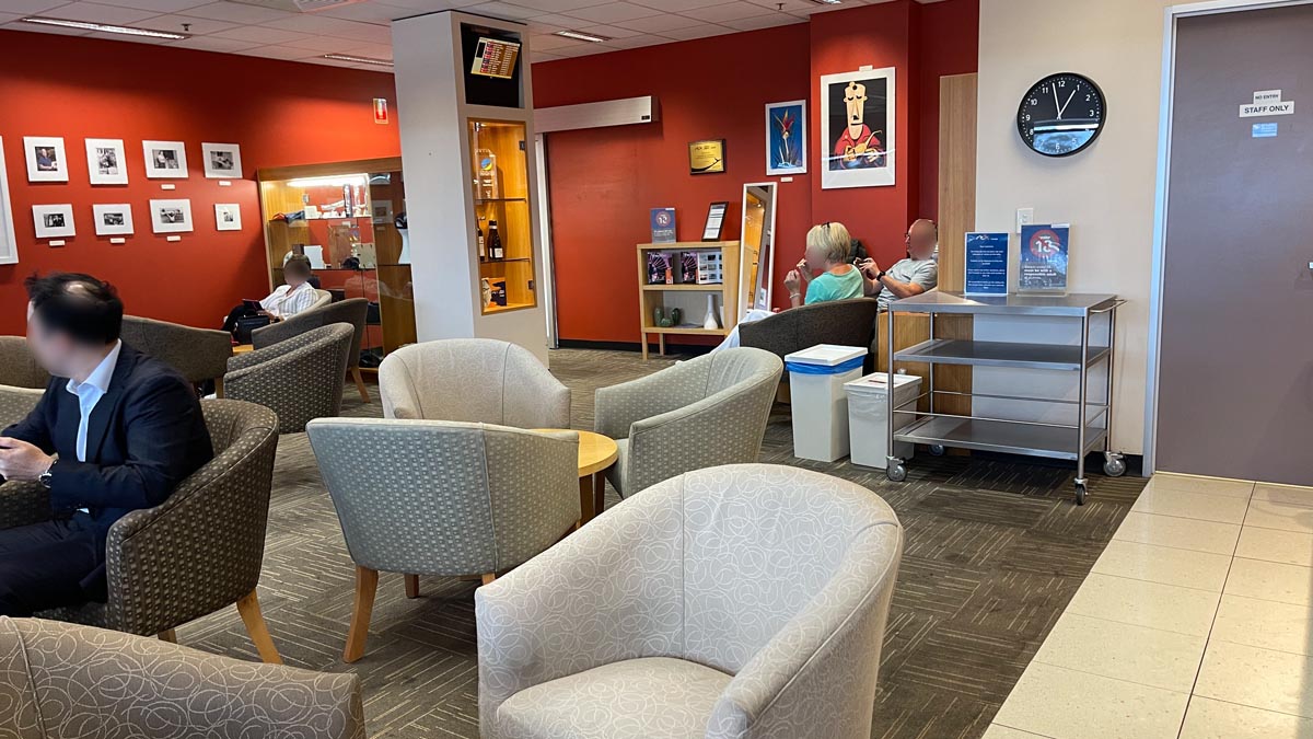 a group of people sitting in a waiting room