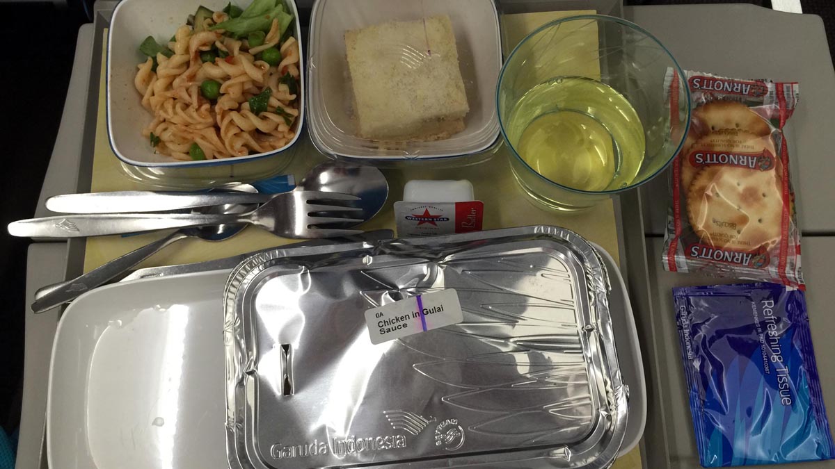 a tray of food and a fork on a tray