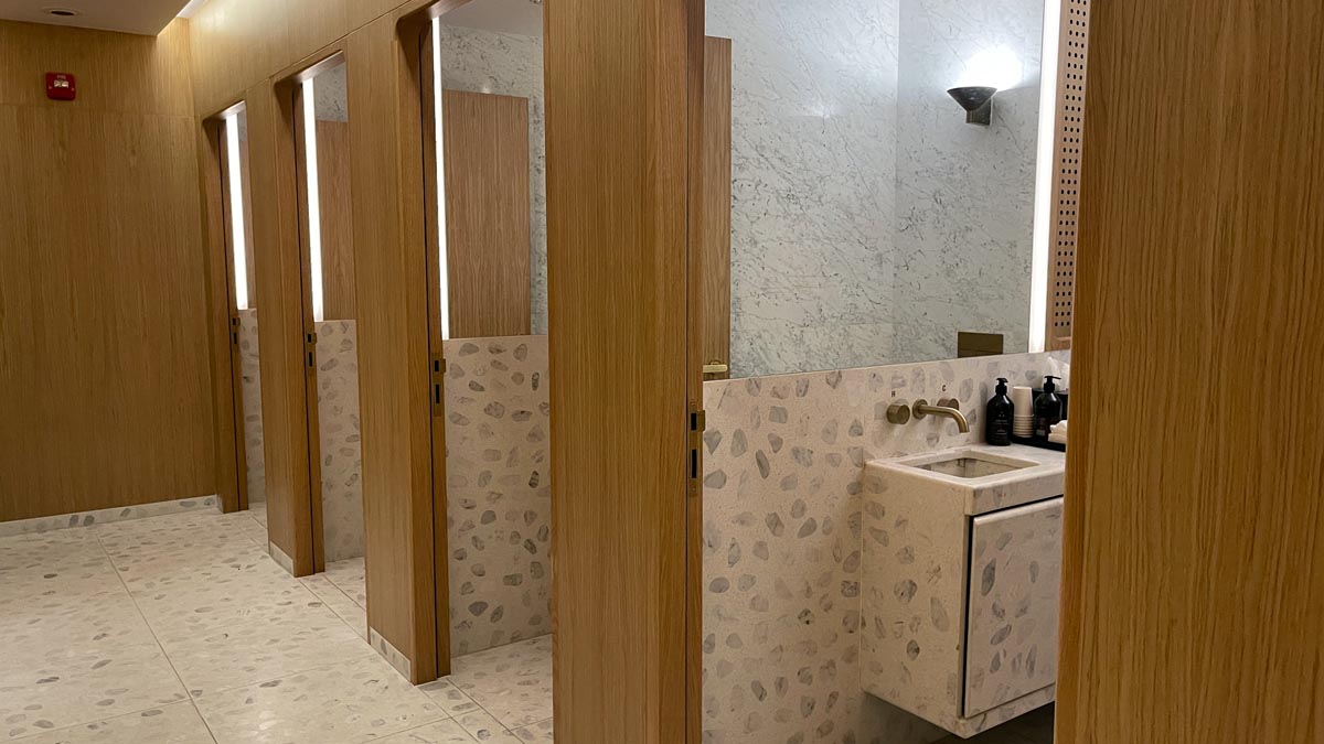 a bathroom with a sink and mirrors