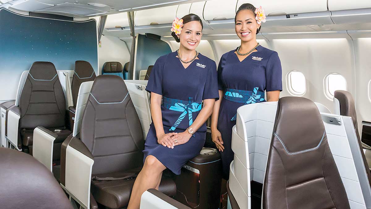 two women in uniform in an airplane