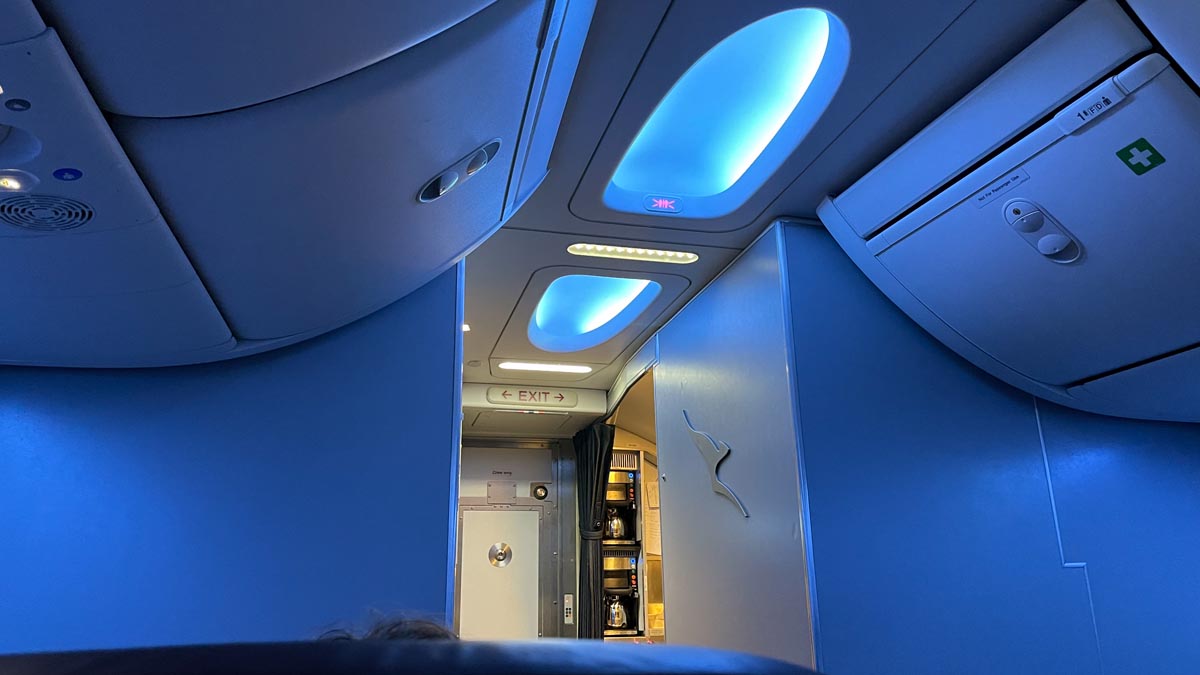 a blue ceiling with lights and a door