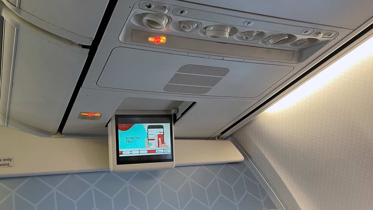 a screen on a plane usually used for playing safety video