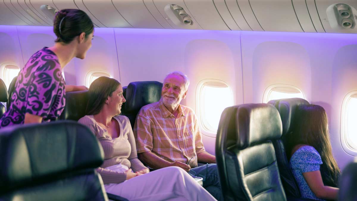 a group of people sitting in an airplane