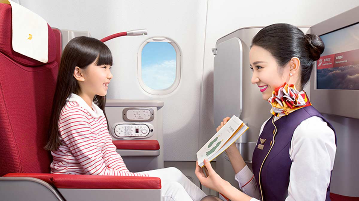 a woman and a child sitting in a plane