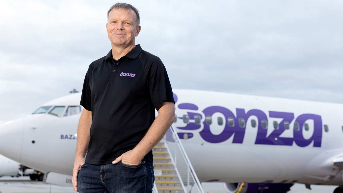 a man standing in front of a plane