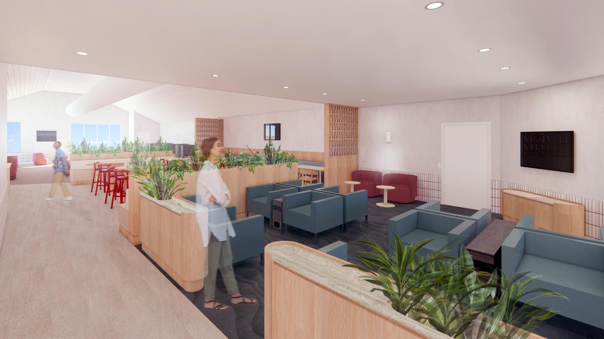 a woman standing in a room with plants