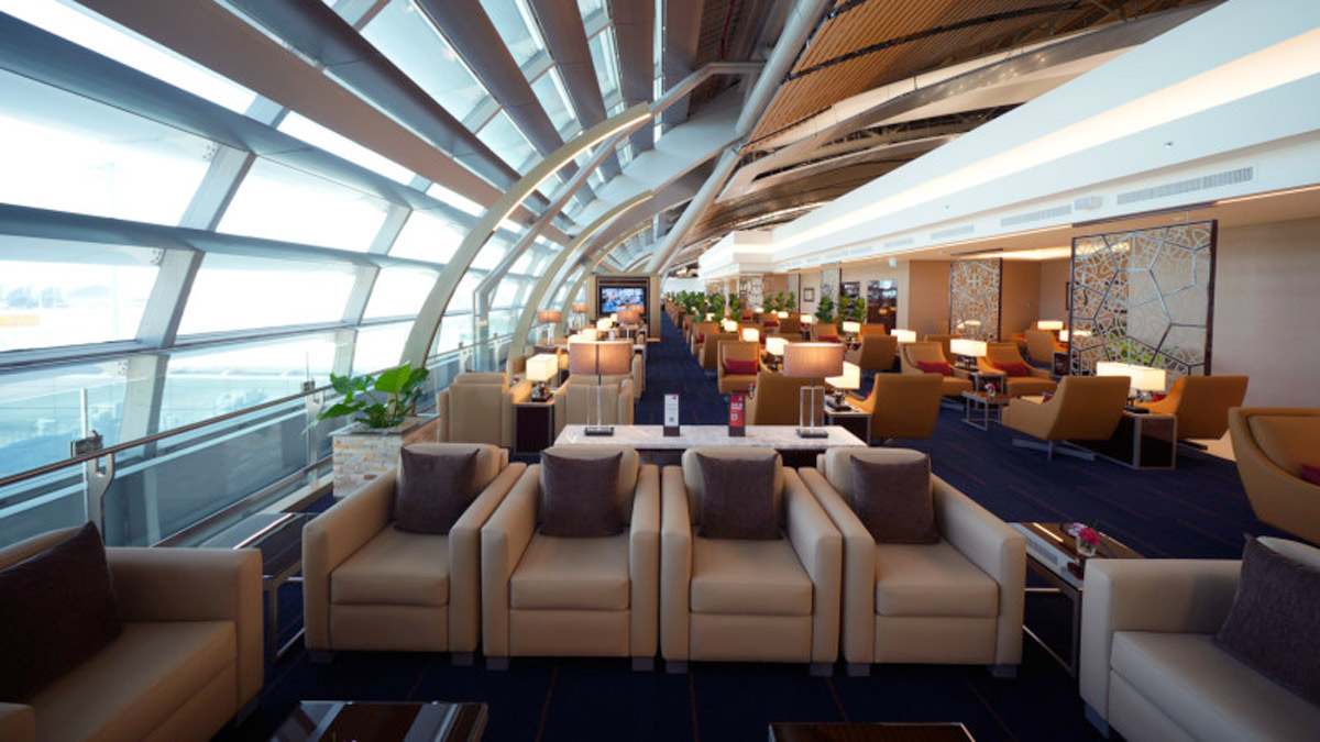 a lounge area with chairs and tables